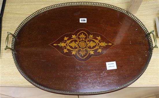 An Edwardian inlaid oval brass galleried tray 61cm long